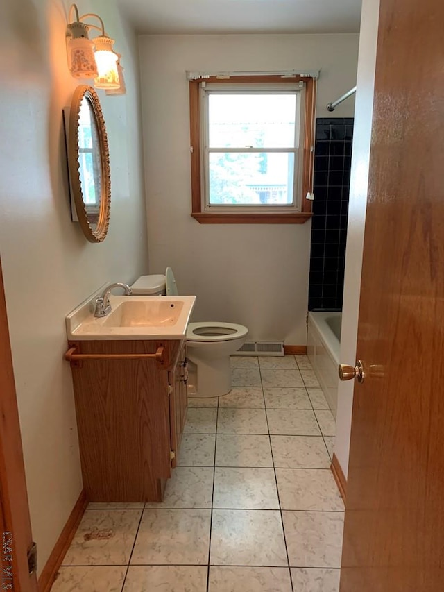 full bathroom with tile patterned flooring, vanity, shower / tub combination, and toilet