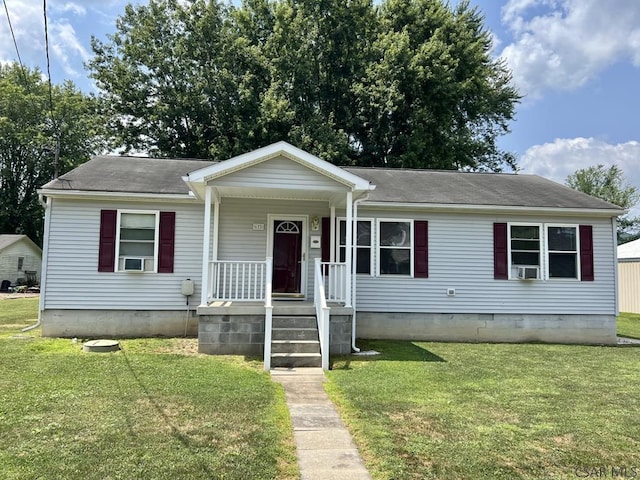 view of front of home featuring cooling unit and a front lawn