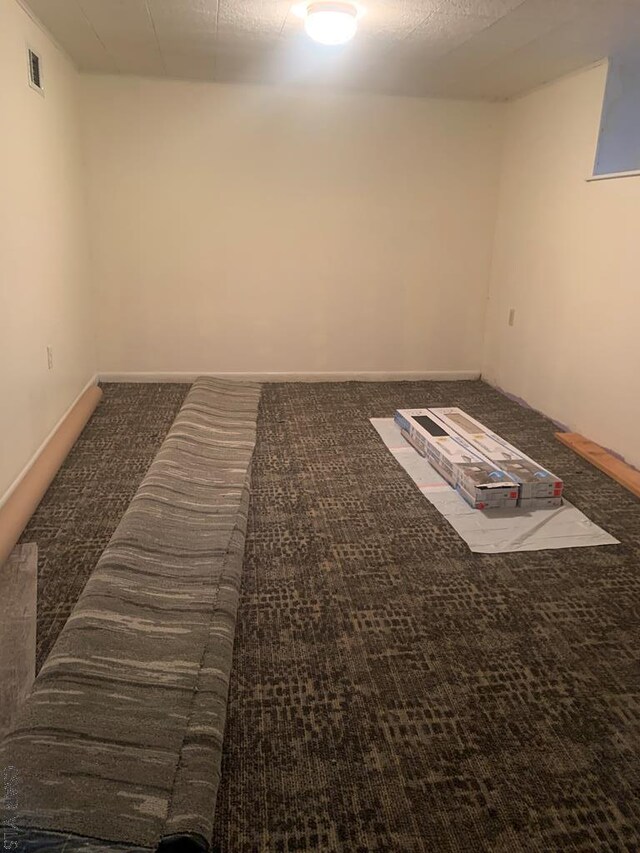 unfurnished room featuring carpet flooring