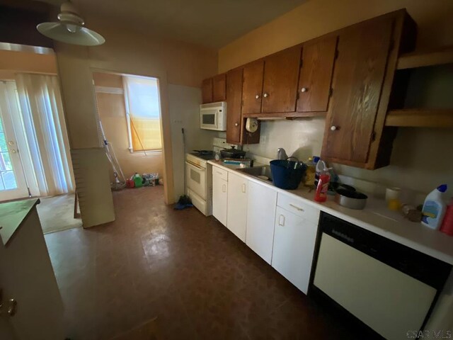 856-858 Ferndale Ave, Johnstown, PA 15905 - kitchen with white cabinetry, white appliances, and sink