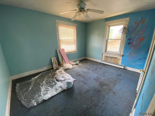 856-858 Ferndale Ave, Johnstown, PA 15905 - carpeted empty room with a baseboard heating unit and ceiling fan