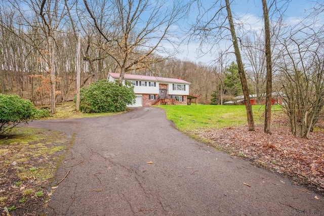 4627 Water Level Rd, Rockwood, PA 15557 - split foyer home with driveway, brick siding, a garage, and a front yard