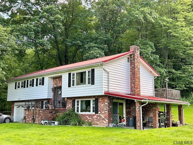 4627 Water Level Rd, Rockwood, PA 15557 - raised ranch with a chimney, a front yard, brick siding, a garage, and a metal roof
