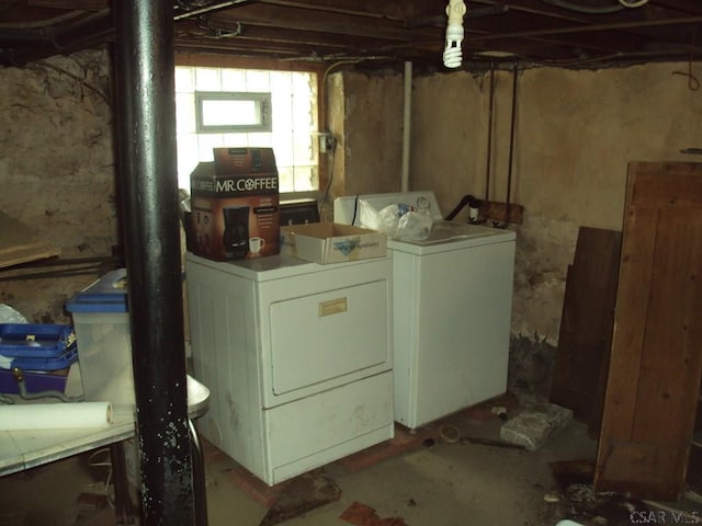 clothes washing area with washing machine and clothes dryer