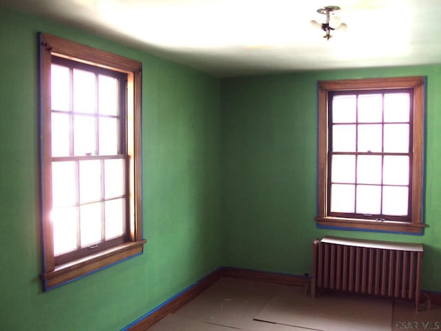331 W Main St, Somerset, PA 15501 - spare room featuring radiator heating unit, healthy amount of natural light, and baseboards
