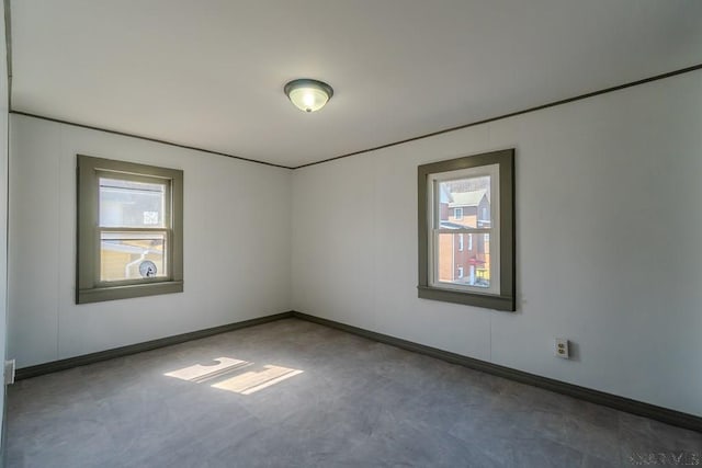 empty room with baseboards