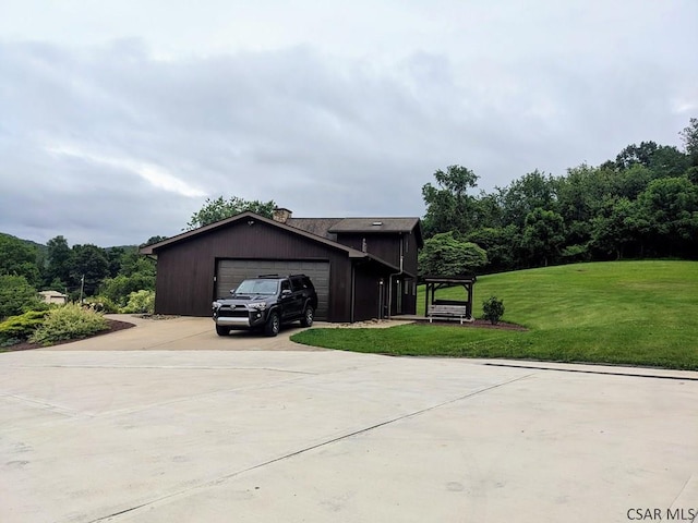 350 American Legion Rd, Latrobe, PA 15650 - view of front of home featuring an attached garage, concrete driveway, a front yard, and an outdoor structure