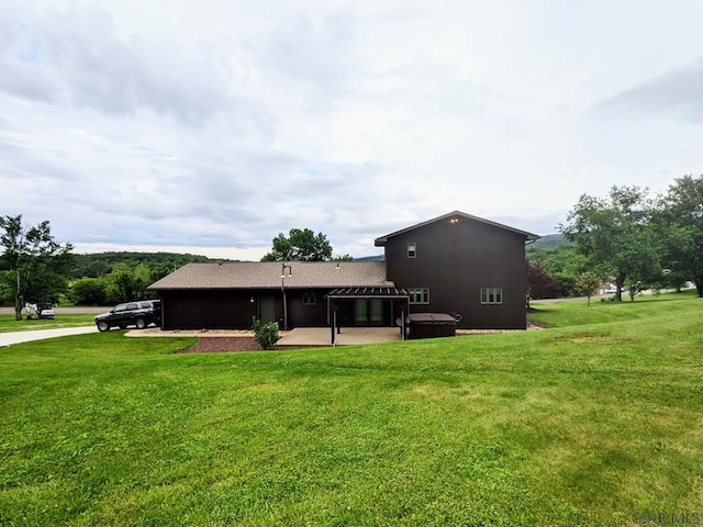 350 American Legion Rd, Latrobe, PA 15650 - back of property with a covered hot tub, a patio, and a yard