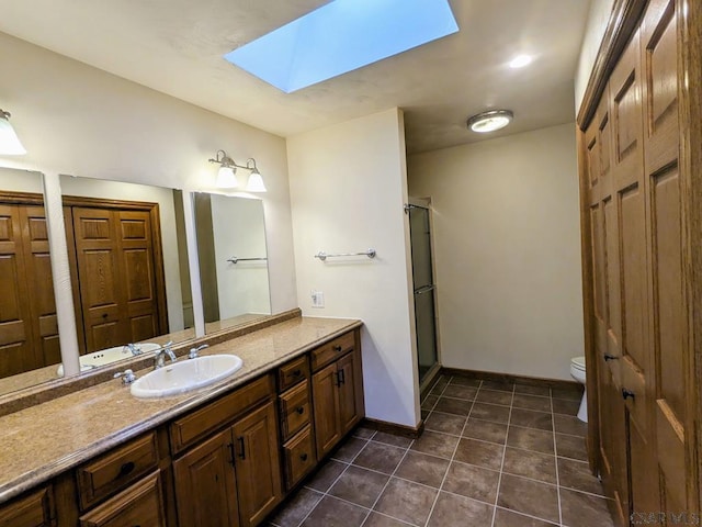 350 American Legion Rd, Latrobe, PA 15650 - bathroom featuring a skylight, vanity, tile patterned floors, a shower with door, and a closet