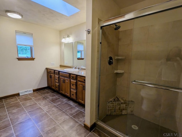 350 American Legion Rd, Latrobe, PA 15650 - full bath featuring a skylight, vanity, a stall shower, and tile patterned flooring