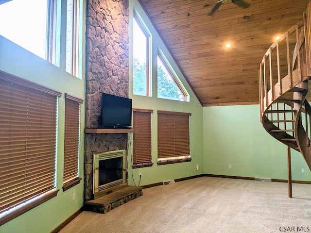 350 American Legion Rd, Latrobe, PA 15650 - unfurnished living room featuring carpet flooring, wood ceiling, a fireplace, high vaulted ceiling, and stairway