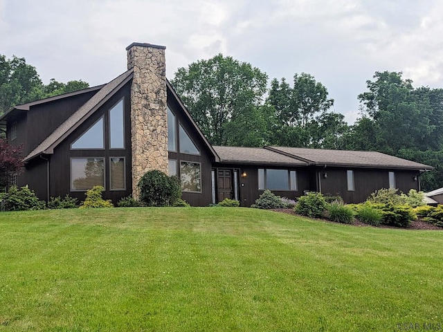 350 American Legion Rd, Latrobe, PA 15650 - back of house featuring a lawn and a chimney