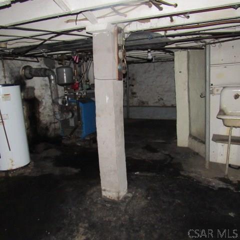 418 Main St, Vintondale, PA 15961 - unfinished basement featuring water heater