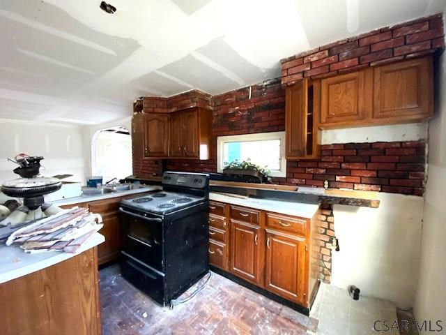 kitchen with sink and electric range