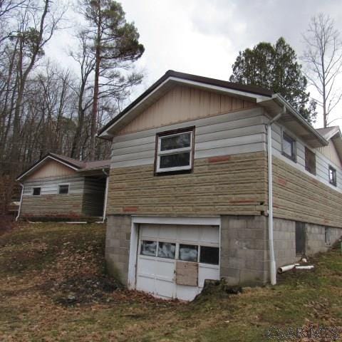 view of property exterior with a garage