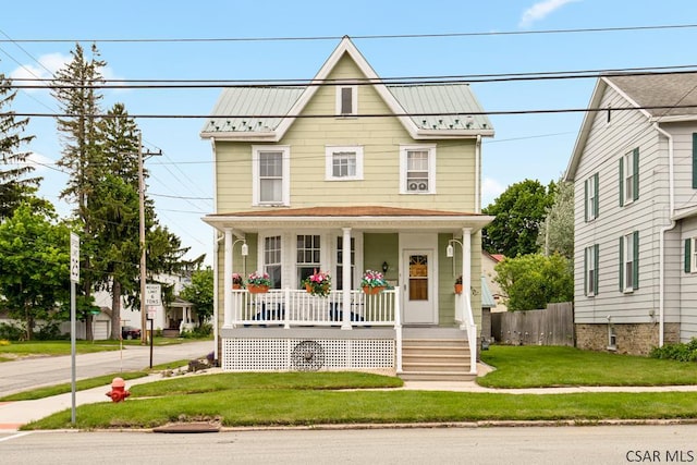540 S Center Ave, Somerset, PA 15501 - view of front facade featuring covered porch, a front lawn, a standing seam roof, and metal roof