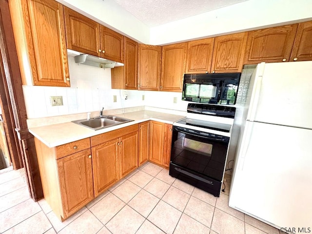 152 Aviator Ln, Friedens, PA 15541 - kitchen featuring black appliances, light countertops, light tile patterned flooring, a textured ceiling, and brown cabinetry