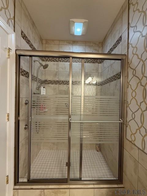 bathroom featuring a stall shower
