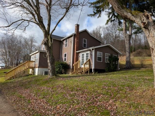 back of house with a yard