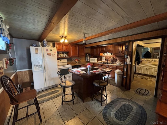 1040 Causeway Dr, Friedens, PA 15541 - kitchen featuring light tile patterned floors, an island with sink, white appliances, wood ceiling, and beam ceiling