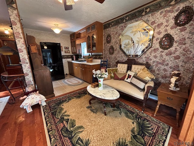 1040 Causeway Dr, Friedens, PA 15541 - living area featuring a textured ceiling, light wood-style flooring, a ceiling fan, and wallpapered walls