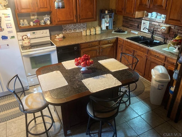 1040 Causeway Dr, Friedens, PA 15541 - kitchen with a breakfast bar, tile patterned floors, white appliances, backsplash, and a sink
