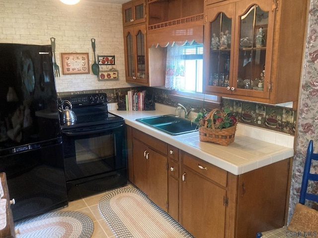 1040 Causeway Dr, Friedens, PA 15541 - kitchen featuring tile countertops, light tile patterned floors, brown cabinetry, black appliances, and a sink