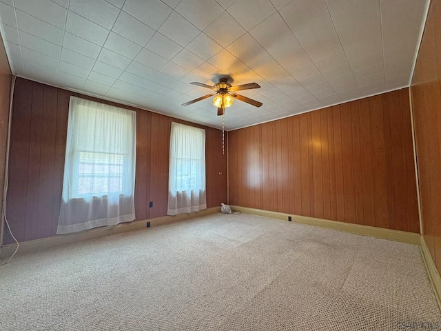 R1249 Main St, Johnstown, PA 15909 - carpeted spare room with a ceiling fan and wooden walls