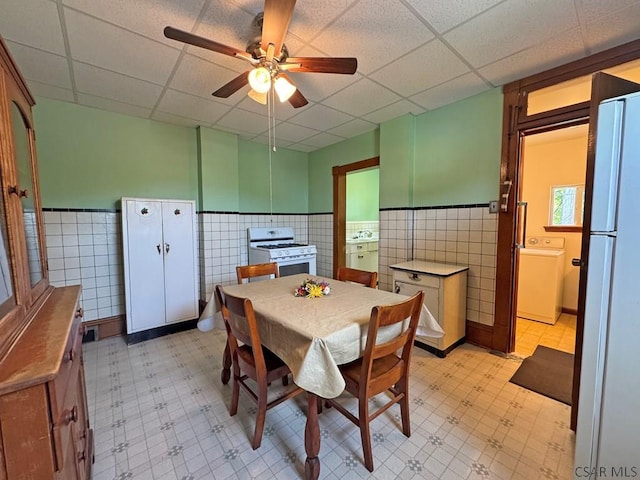 R1249 Main St, Johnstown, PA 15909 - dining room with tile walls, light flooring, a drop ceiling, ceiling fan, and washer / clothes dryer