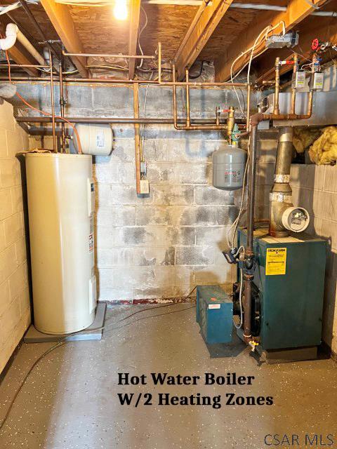 utility room featuring a heating unit and water heater