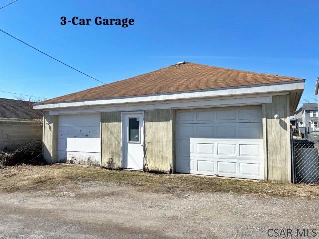 detached garage with fence