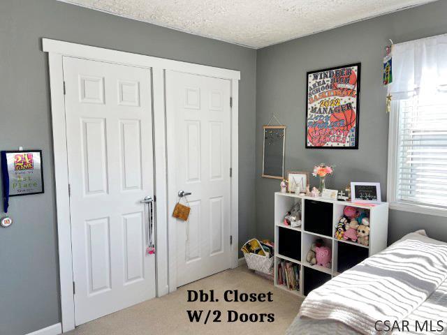 bedroom featuring a textured ceiling