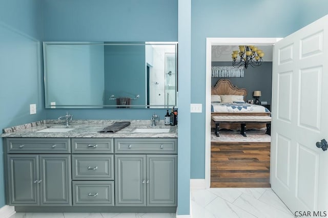 bathroom featuring vanity and a notable chandelier