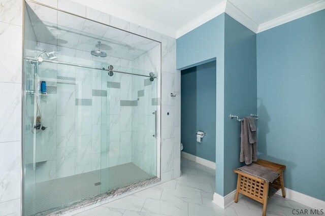 bathroom featuring crown molding, toilet, and a shower with shower door