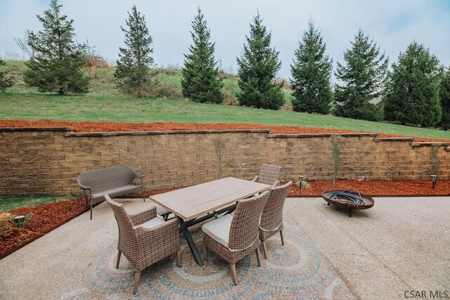 view of patio / terrace featuring a fire pit