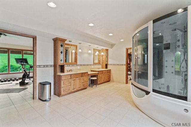 373 Hillside Ln, Somerset, PA 15501 - bathroom featuring tile walls, a shower stall, vanity, a soaking tub, and a wainscoted wall