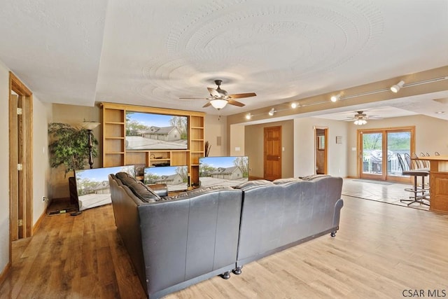 373 Hillside Ln, Somerset, PA 15501 - living room featuring a ceiling fan, light wood-style flooring, built in features, and a textured ceiling
