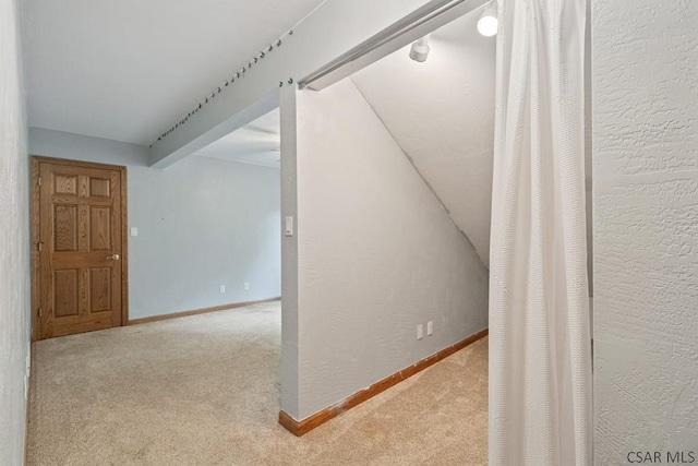 373 Hillside Ln, Somerset, PA 15501 - corridor with carpet flooring, baseboards, a textured wall, and lofted ceiling