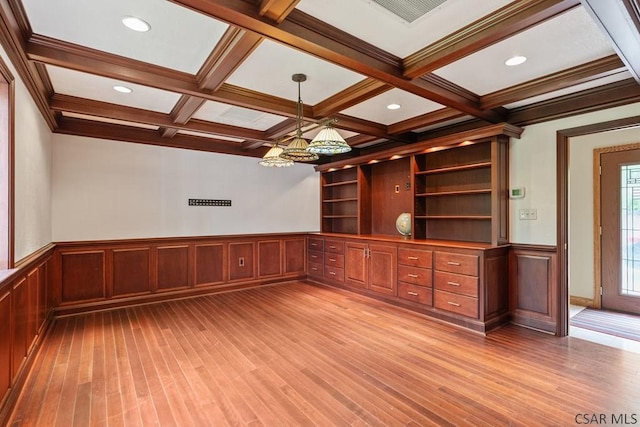 373 Hillside Ln, Somerset, PA 15501 - unfurnished living room featuring beam ceiling, light wood-style floors, coffered ceiling, a wainscoted wall, and a chandelier