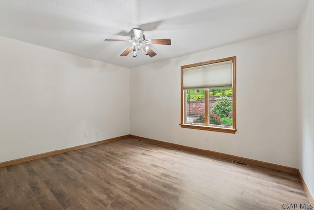 373 Hillside Ln, Somerset, PA 15501 - spare room with wood finished floors, ceiling fan, and baseboards