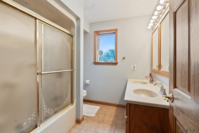 373 Hillside Ln, Somerset, PA 15501 - bathroom featuring double vanity, toilet, tile patterned floors, combined bath / shower with glass door, and baseboards
