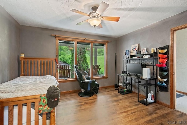 373 Hillside Ln, Somerset, PA 15501 - bedroom featuring wood finished floors, baseboards, and a ceiling fan