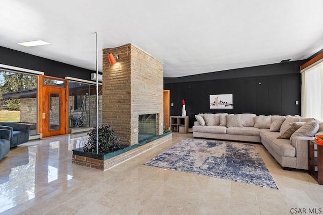 living room with a stone fireplace