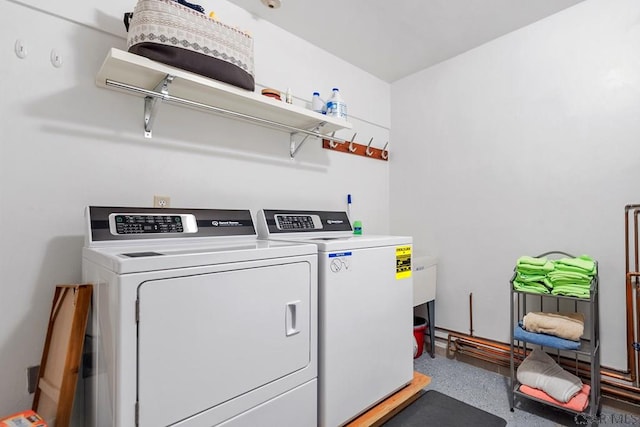 laundry room with washer and dryer and laundry area