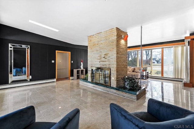 living area featuring baseboard heating and a brick fireplace