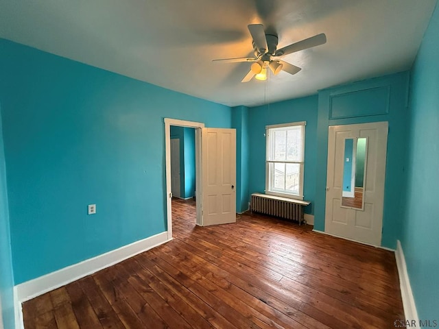 unfurnished bedroom with radiator, baseboards, ceiling fan, and dark wood-style flooring