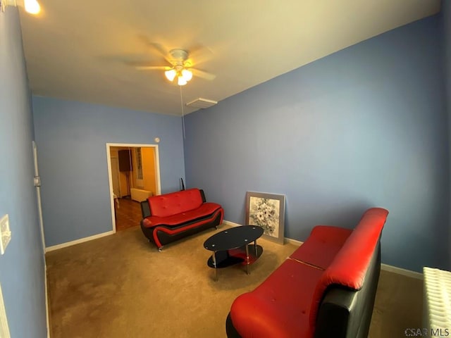 living area featuring carpet floors, vaulted ceiling, and baseboards