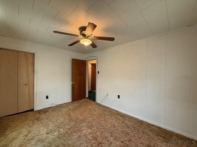 201 7th St, Windber, PA 15963 - unfurnished bedroom with carpet floors and ceiling fan