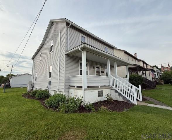 201 7th St, Windber, PA 15963 - view of property exterior with covered porch and a yard