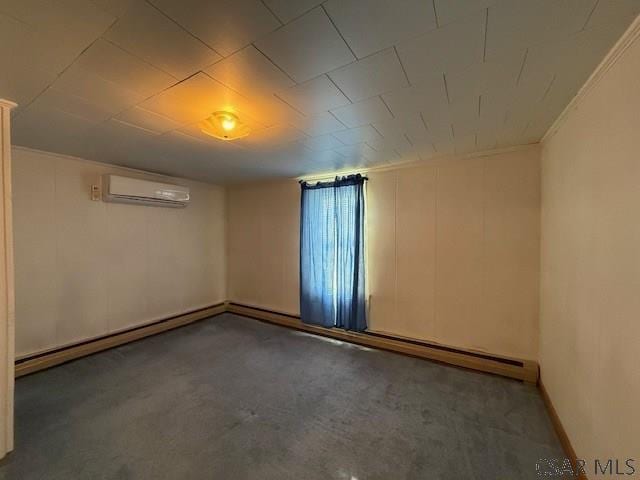 201 7th St, Windber, PA 15963 - spare room with a wall mounted AC, carpet flooring, and a baseboard radiator